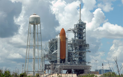 At Kennedy Space Center's Launch Pad 39B, Space Shuttle Discovery is largely hidden by the Rotating Service Structure. Image credit: NASA/KSC