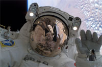 Japanese Aerospace Exploration Agency Astronaut Soichi Noguchi waves at his spac