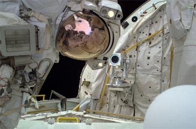 Mission Specialist Steve Robinson floats in the cargo bay on Discovery's aft end during the second STS-114 spacewalk. (Image Credit: NASA)
